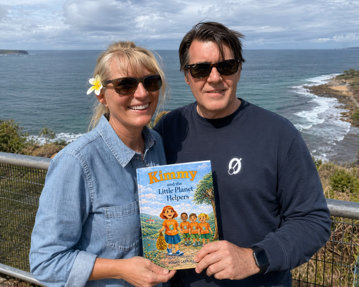 Rogan and Kim Carroll holding Kimmy and the Little Planet Helpers